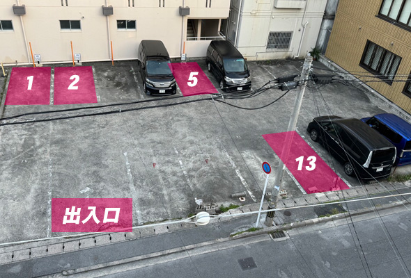 Parking lot with spaces 1, 2, 5 and 13 and the entrance
